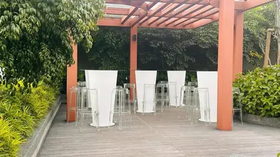 a group of tables and chairs on a patio at KLCC view couple stay 276A at KLCC in Kuala Lumpur