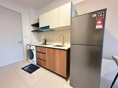 a kitchen with a stainless steel refrigerator and a dishwasher at Luxury private family suite 26161BR at KLCC in Kuala Lumpur