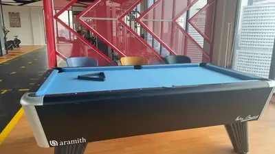 a pool table in the middle of a room at KLCC view cozy suite 251A at KLCC in Kuala Lumpur