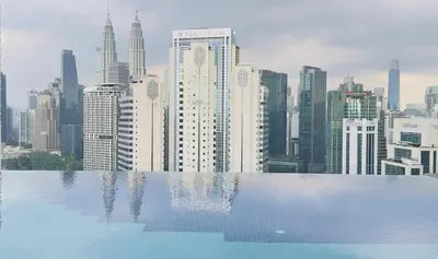 a view of a city skyline from a swimming pool at KLCC view suite 292B at Majestic residence in Kuala Lumpur