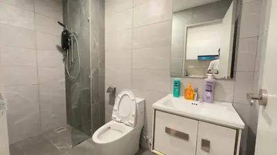 a bathroom with a toilet and a shower and a sink at Luxe suite for couple 297B at Majestic Residence in Kuala Lumpur