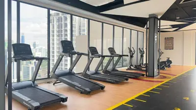 a gym with a bunch of treadmills in a building at Couple luxury suite 275B at Majestic Residence in Kuala Lumpur