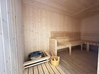 a sauna with a bench and a fire in it at Klcc view Luxe suite 295B at Majestic Residence in Kuala Lumpur
