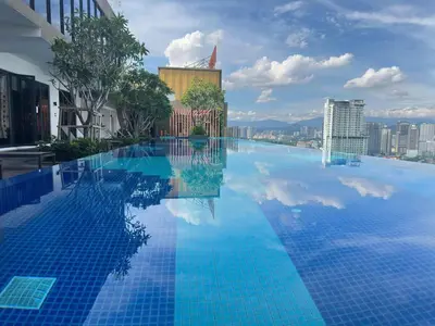 a large swimming pool with a view of a city at Klcc view Luxe suite 295B at Majestic Residence in Kuala Lumpur