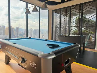 a pool table in a room with a view at Private family suite 29201BR at Majestic Residence in Kuala Lumpur