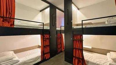 a bedroom with two bunk beds in a room at Traveller Ark Hotel and Bunks in Kuala Lumpur