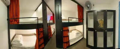 a room with two bunk beds and a mirror at Traveller Ark Hotel and Bunks in Kuala Lumpur