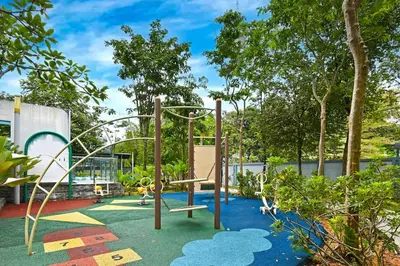 a playground in a garden with a swing at The Pureloft Suites - Bukit Bintang KLCC in Kuala Lumpur