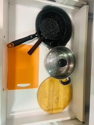 a pot and pan hanging on a wall at Mercu summer suites klcc luxury couple 1BR apartment with balcony, pool view free Netflix in Kuala Lumpur
