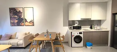 a kitchen and living room with a couch and a table at Service Apartment Agile Residence KL in Kuala Lumpur