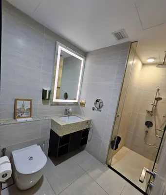 a bathroom with a toilet and a sink and a shower at Star residence KLCC by J&K in Kuala Lumpur