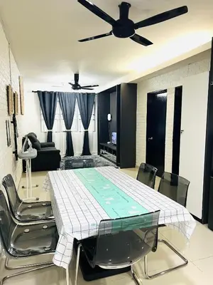 a room with a table and chairs and a ceiling fan at Homestay Ustaz Lumayan in Kuala Lumpur