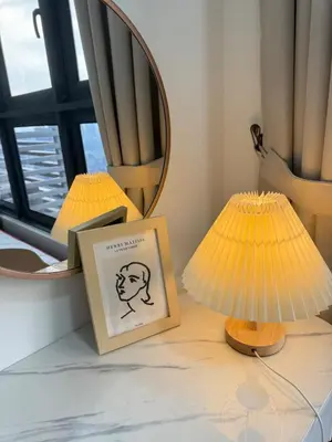 a table with two lamps and a picture and a mirror at M Vertica w Infinity Pool Mrt TRX Sunway Velocity in Kuala Lumpur