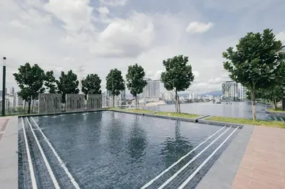 a swimming pool with a city skyline in the background at M Vertica w Infinity Pool Mrt TRX Sunway Velocity in Kuala Lumpur