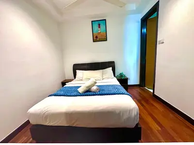 a bedroom with a bed with a pillow on it at Casa Residency in Kuala Lumpur