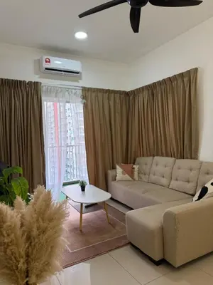 a living room with a couch and a table at Razak City Residence KL City in Kuala Lumpur