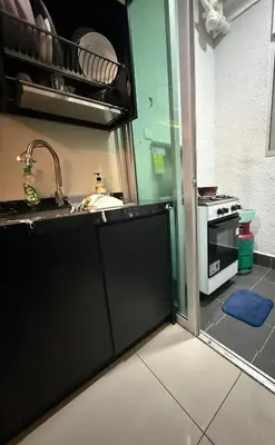 a kitchen with a sink and a stove at Razak City Residence KL City in Kuala Lumpur