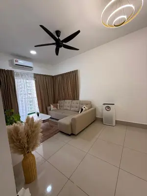 a living room with a couch and a ceiling fan at Razak City Residence KL City in Kuala Lumpur