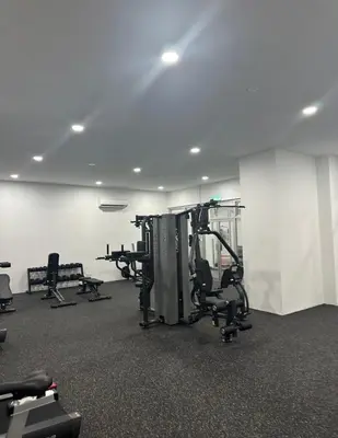 a gym with several tread machines in a room at Razak City Residence KL City in Kuala Lumpur