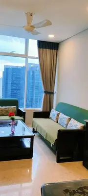 a living room with a couch and a coffee table at Sky Suites KLCC by TD Luxe Global in Kuala Lumpur