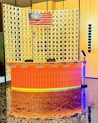 a table with a flag on top of it at Majestic Residences KLCC By Moonlight in Kuala Lumpur