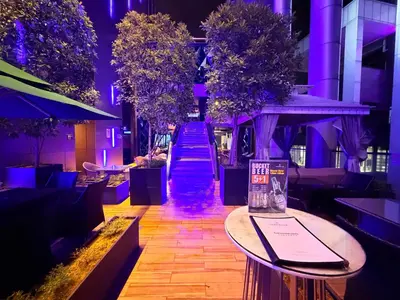 a hallway with trees and stairs in a building at Platinum Suites Kuala Lumpur Malaysia By LuzBnB in Kuala Lumpur