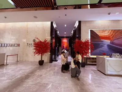 a group of people standing in a lobby at Platinum Suites Kuala Lumpur Malaysia By LuzBnB in Kuala Lumpur