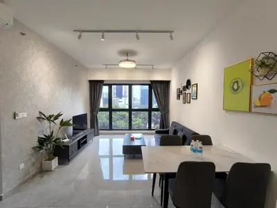 a living room with a couch and a table at Sky View Agile Residence Bukit Bintang KL in Kuala Lumpur