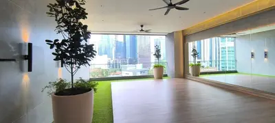 a large room with a large window with a plant at Service Residence Agile Delima Residence KL in Kuala Lumpur