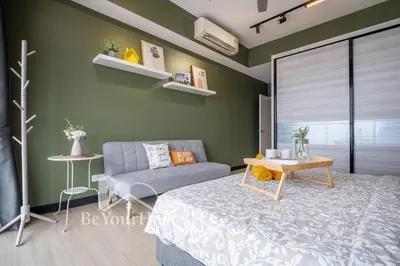 a living room with a couch and a table at Continew Residences Kuala Lumpur in Kuala Lumpur