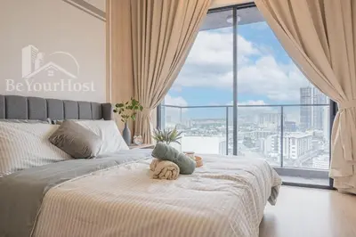 a bedroom with a bed with a teddy bear on it at Continew Residences Kuala Lumpur in Kuala Lumpur