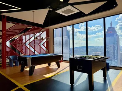 two pool tables in a room with a view at The Majestic Residence Kuala Lumpur in Kuala Lumpur
