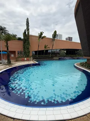 a large swimming pool in front of a building at Times Square KL Serviced Suite in Kuala Lumpur