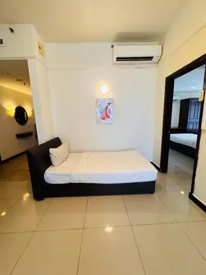 a bedroom with a bed in a room at Times Square KL Serviced Suite in Kuala Lumpur