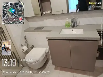 a bathroom with a sink and a toilet and a mirror at Eaton resident full luxury in Kuala Lumpur