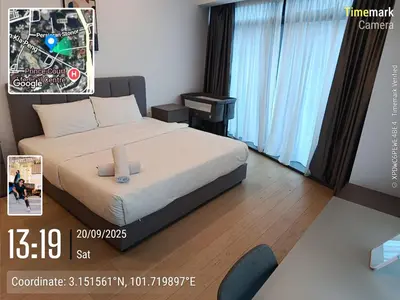 a hotel room with a bed and a tv at Eaton resident full luxury in Kuala Lumpur
