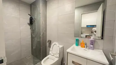 a bathroom with a shower and a toilet and a sink at KLCC view suite 1601B at Majestic Residence in Kuala Lumpur