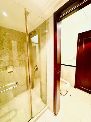 a bathroom with a shower and a toilet at Signature Suite at Time Square by Regal in Kuala Lumpur