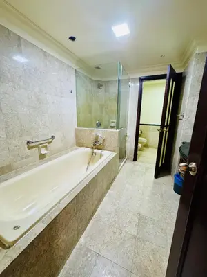 a large bathroom with a tub and a shower at Signature Suite at Time Square by Regal in Kuala Lumpur