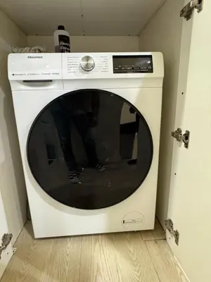a white washing machine sitting in a room at PWTC Chamber Rock by AZ Line in Kuala Lumpur