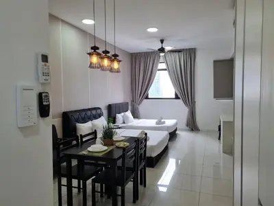 a room with a bed and a table and chairs at SUITES At CHAMBERS KLCC KUALALAMPUR in Kuala Lumpur