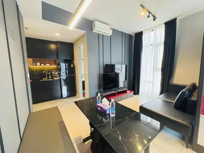 a living room with a couch and a table at Axon Purple Suite Kuala Lampur in Kuala Lumpur