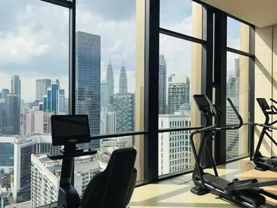 an office with a view of a city skyline at Axon Purple Suite Kuala Lampur in Kuala Lumpur