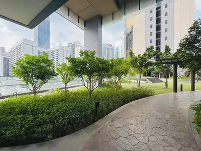 a walkway in a city with tall buildings at Axon Purple Suite Kuala Lampur in Kuala Lumpur