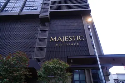 a sign on the side of a building at Luxury Suites Majestic Residences at Heart of KLCC in Kuala Lumpur