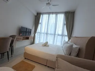 a bedroom with a bed and a large window at Luxury Suites Majestic Residences at Heart of KLCC in Kuala Lumpur