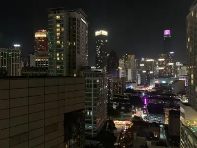 a view of a city at night at seri bukit ceylon by sweet cozy house in Kuala Lumpur