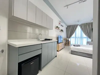 a kitchen with a sink and a bed in a room at The Majestic Residence By Awesomestay in Kuala Lumpur