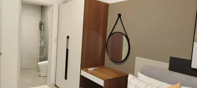 a bathroom with a mirror and a sink and a toilet at Majestic Infinity Pool by KLCC in Kuala Lumpur