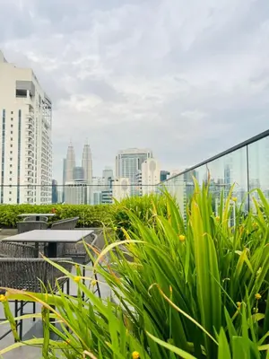 a view of the city from the roof of a building at Majestic Infinity Pool by KLCC in Kuala Lumpur